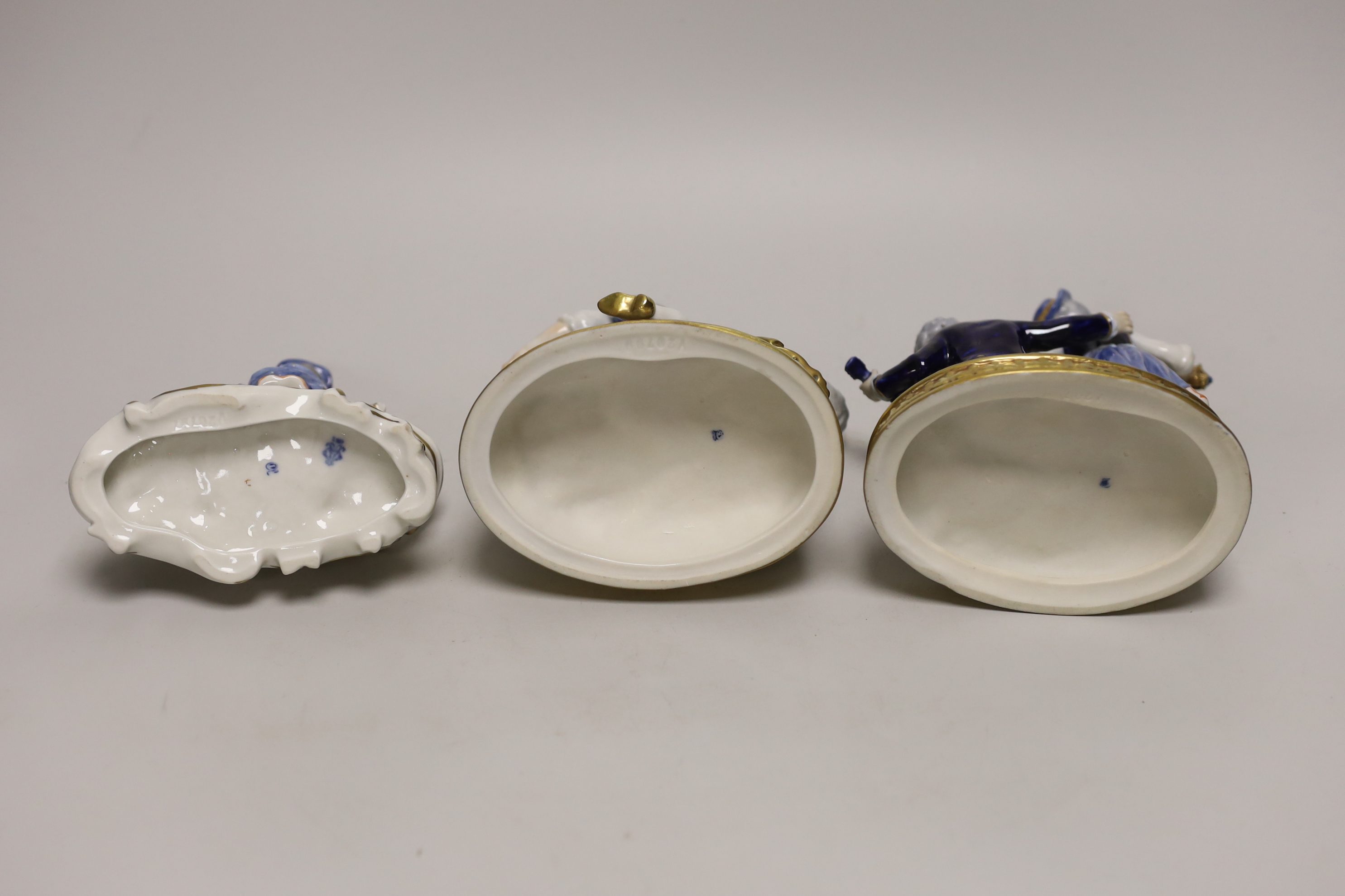 Two German porcelain figure groups and figural salt, tallest 17cms high